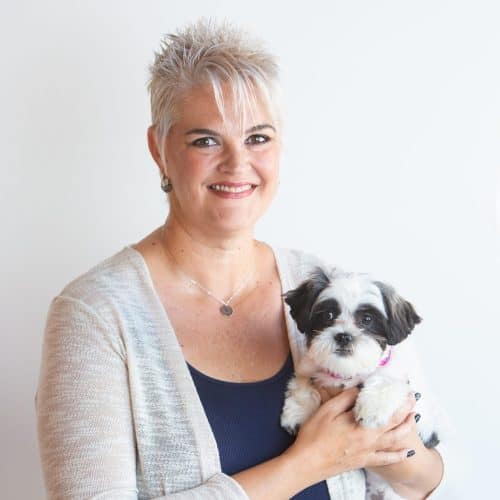 Janie Budnick holding a small dog